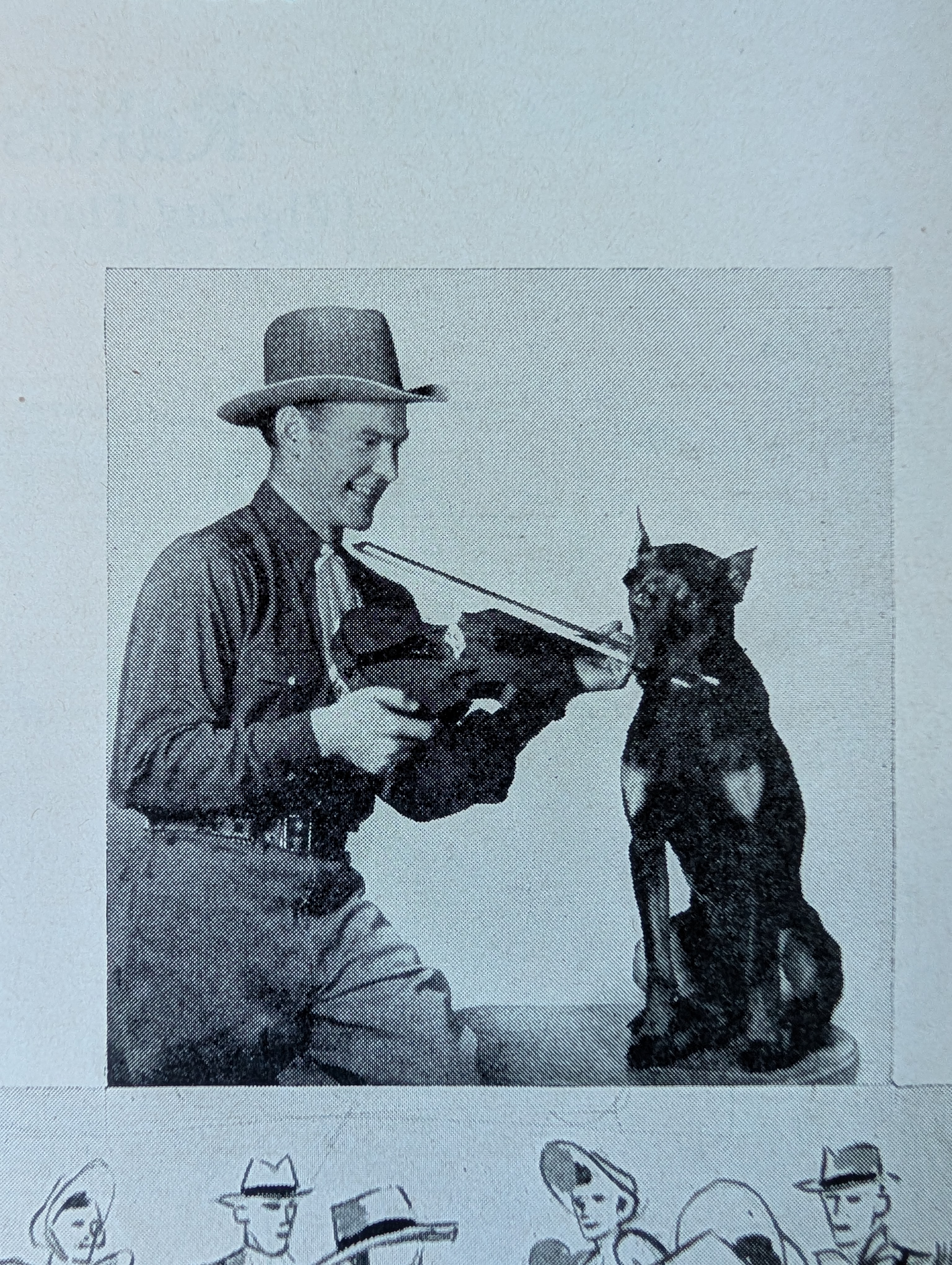 Classic old-time photo of Arkie allowing a dog to grip the violin bow in its mouth and play his fiddle.